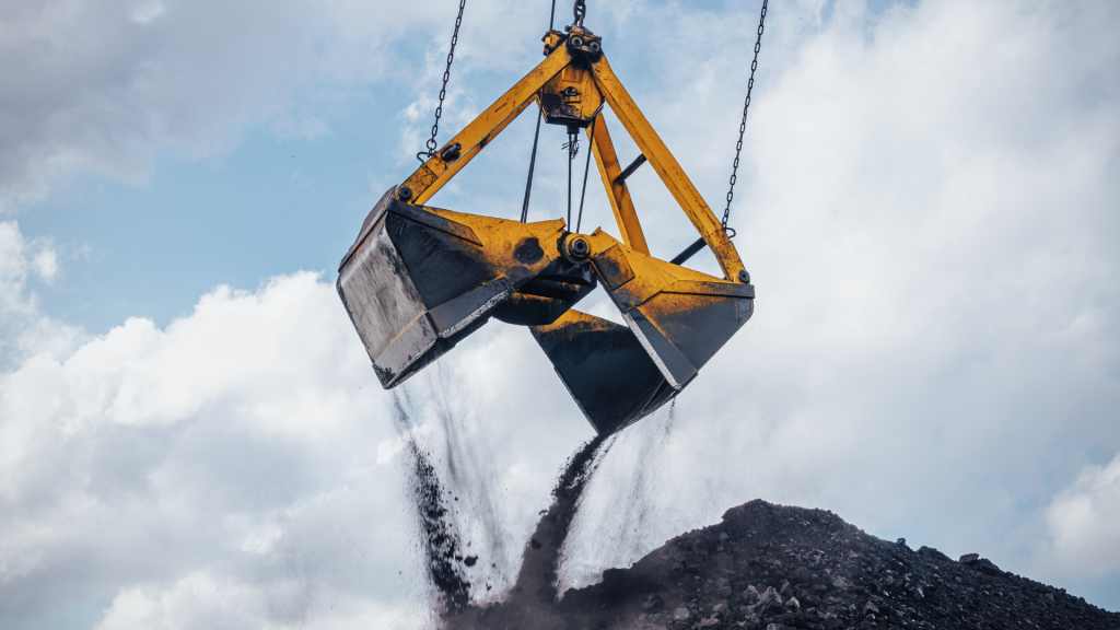 Crane Bucket Pouring Coal Outdoors