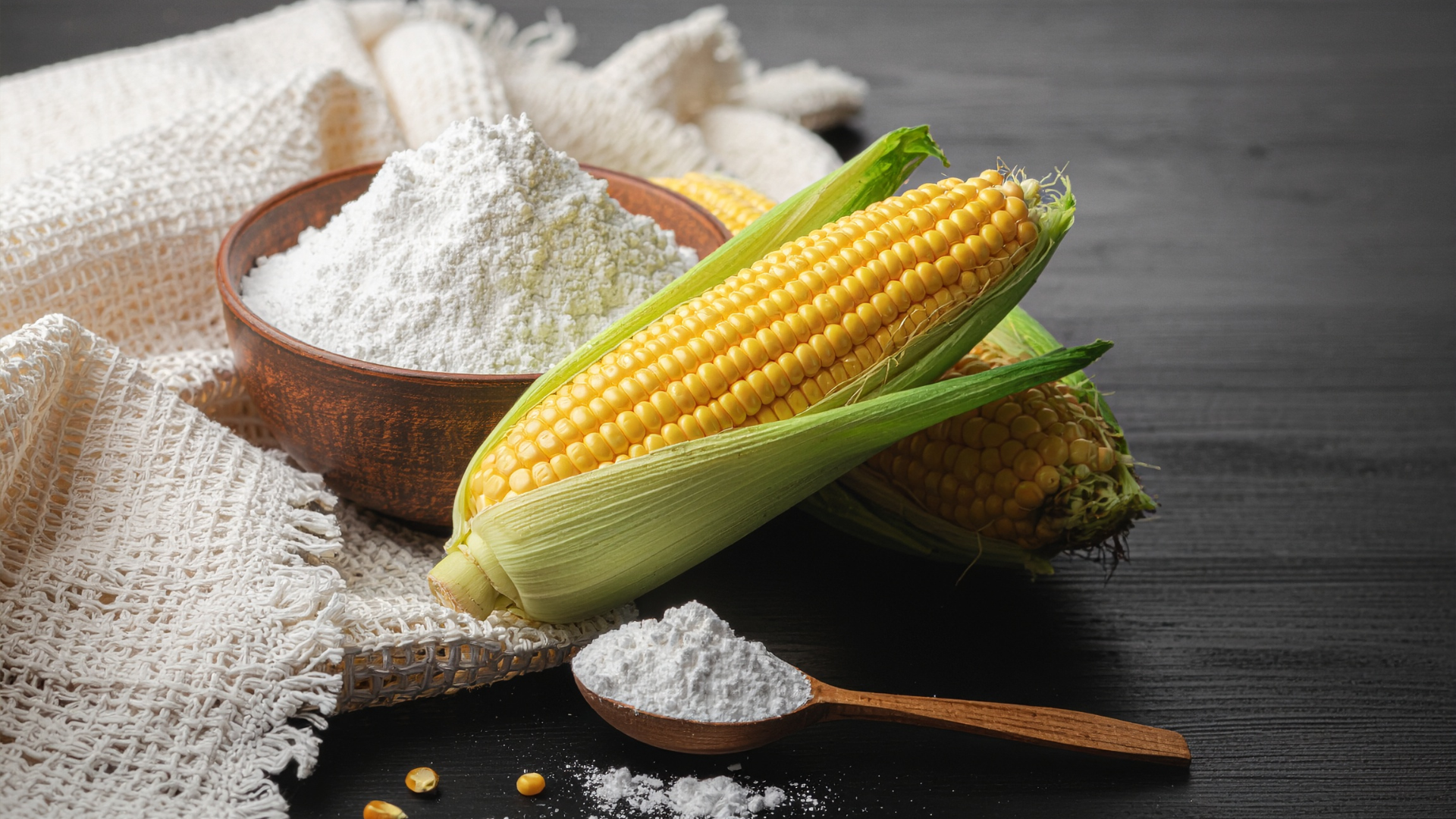 Cornstarch with Corn Cobs on Wooden Table