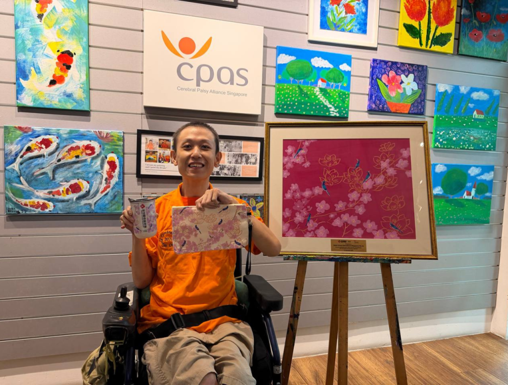 Beneficiary of Cerebral Palsy Alliance Singapore sharing his artwork and artwork-turned-corporate gifts (sparrow)