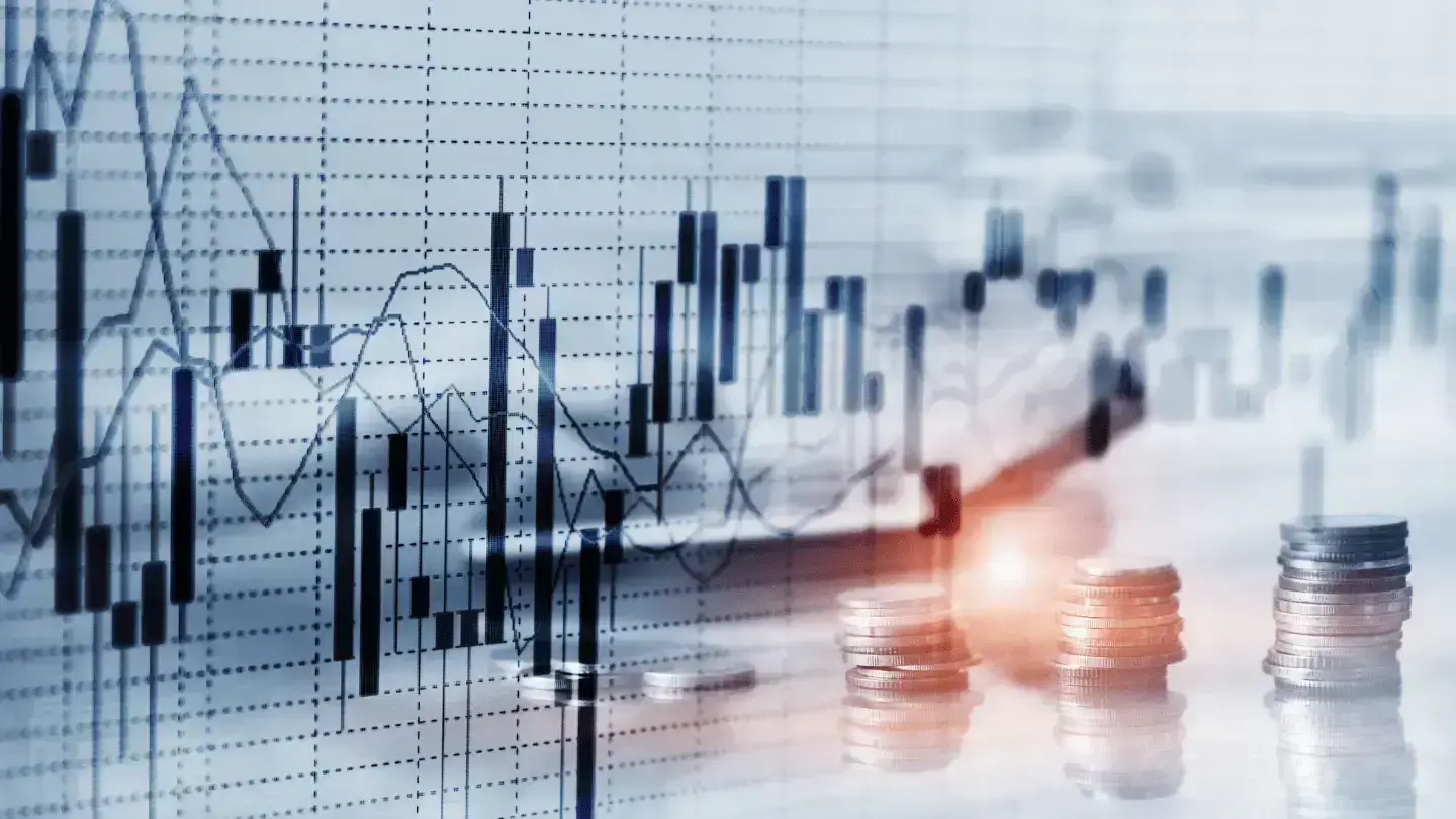 Financial market chart with candlestick patterns and stacked coins symbolizing investment growth, market performance, and trading activity.