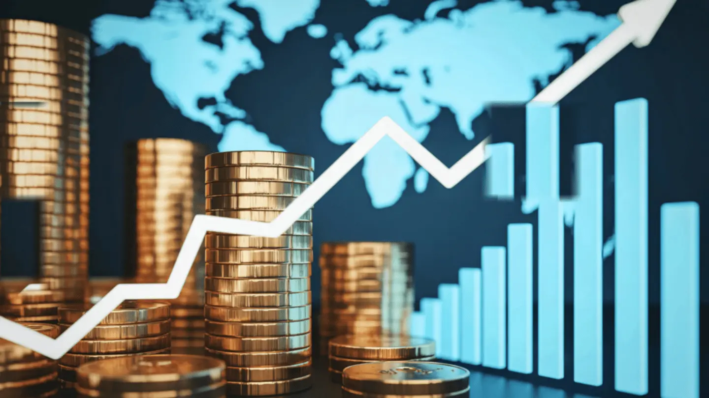 Global financial growth illustrated by stacks of gold coins and upward trending graph