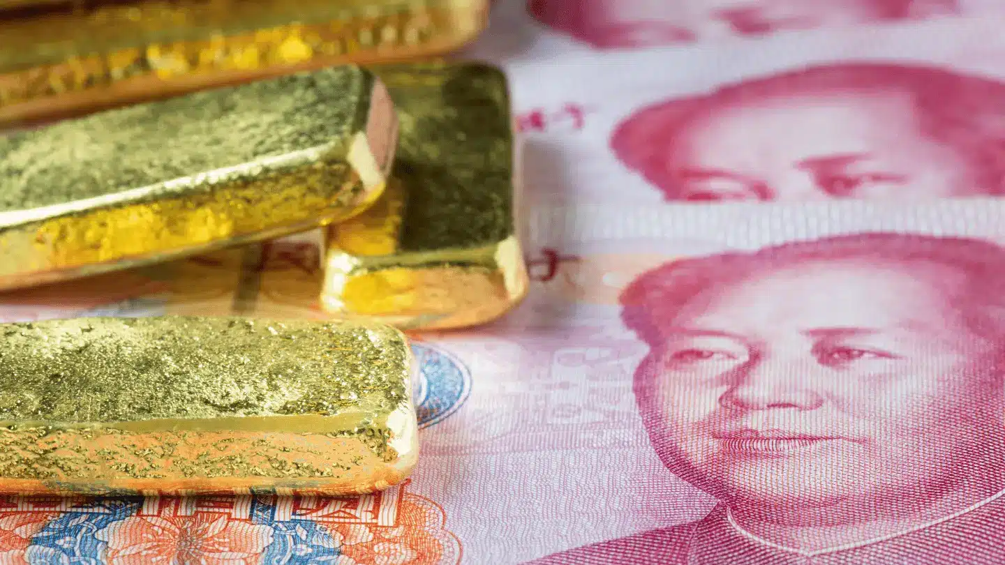 Closeup gold bar with china banknote, Stacked of gold bar with yuan for business concept