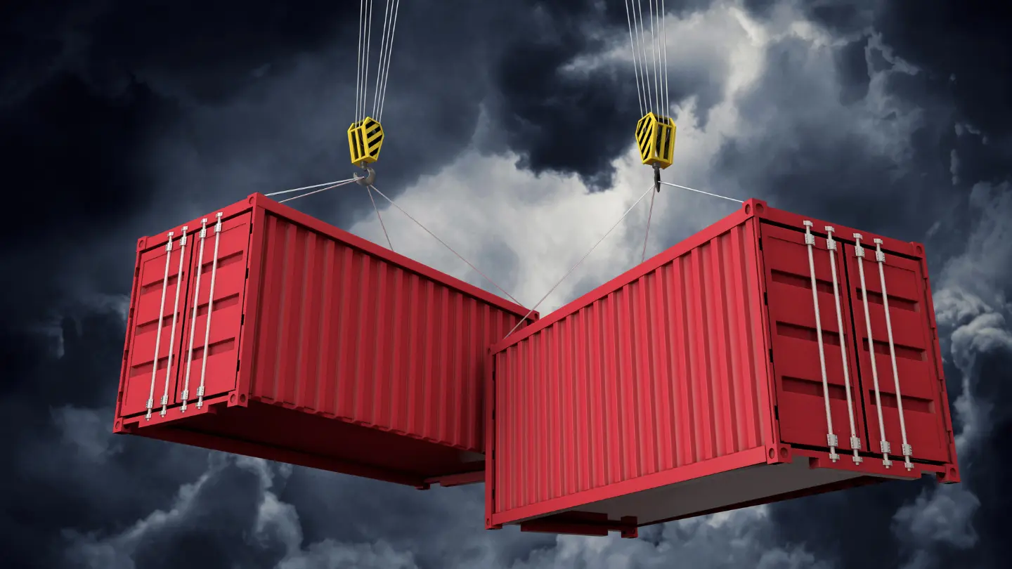 Shipping Containers from Cranes with Dark Clouds