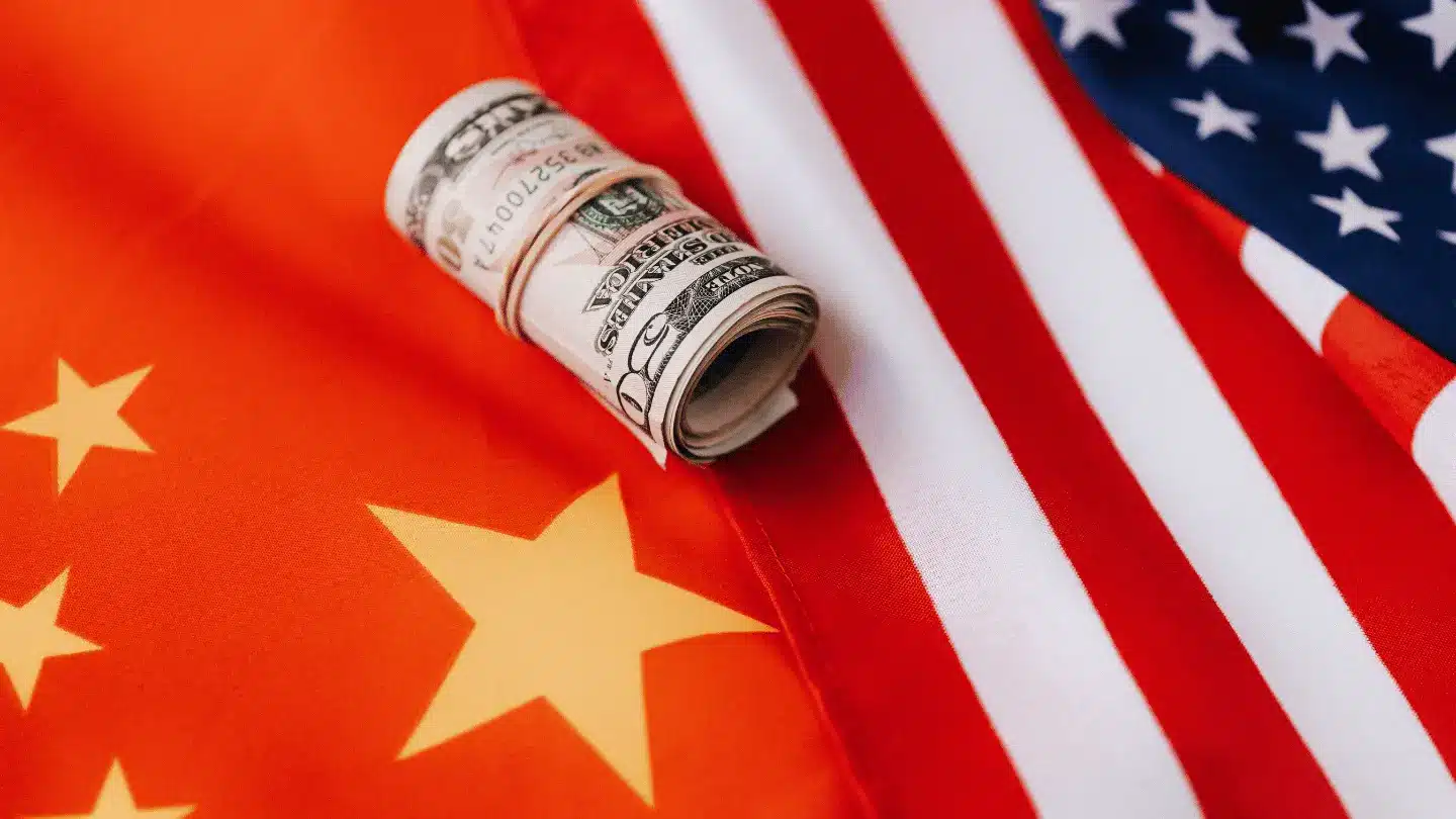 Colorful flag of America and roll of paper bills