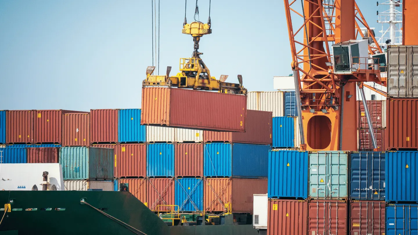 Shipping containers being loaded at port