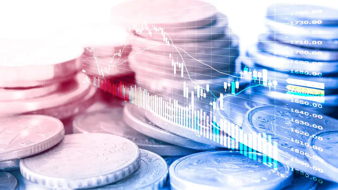 Financial graph overlaying stacks of coins
